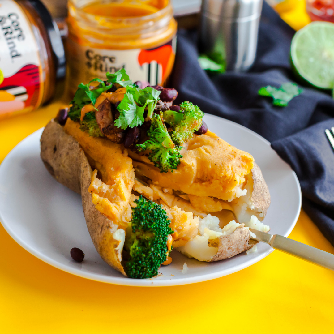Loaded Baked Potatoes Stuffed with Cheesy Sauce